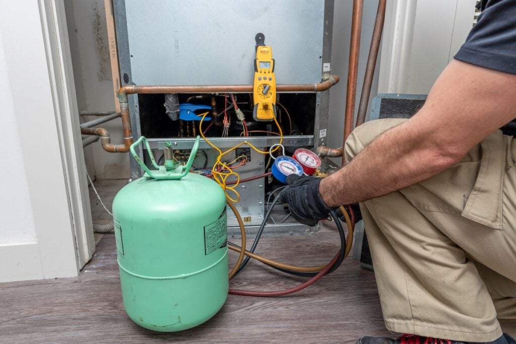 Charging a water based air conditioner heat pump system