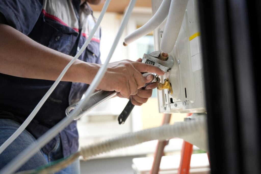 HVAC Maintenance and Repair Work, Professional Air Conditioner Installation or Service in Progress