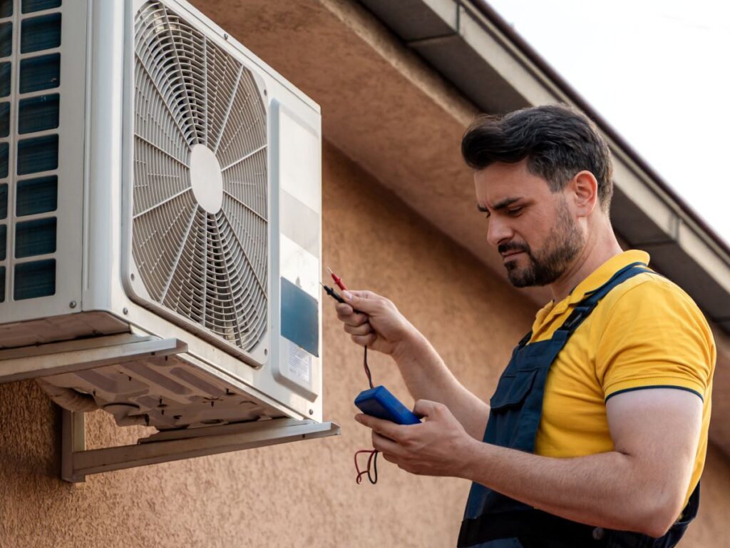 ac blower motor worker repairing outdoor unit
