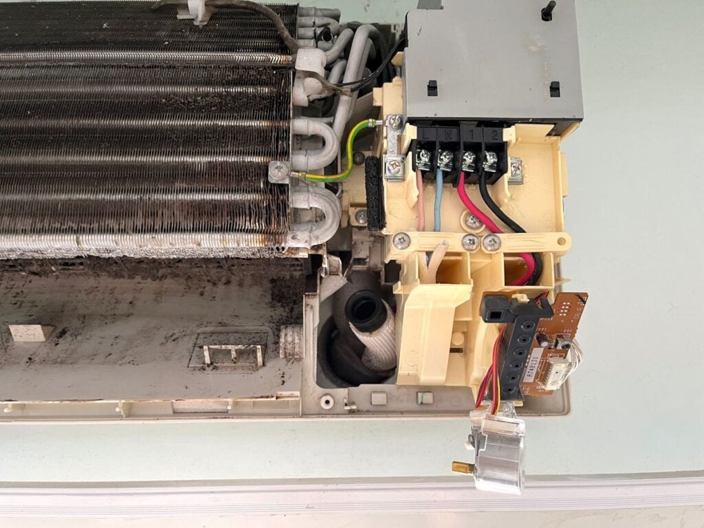 mold in air conditioner open old unit dark spots