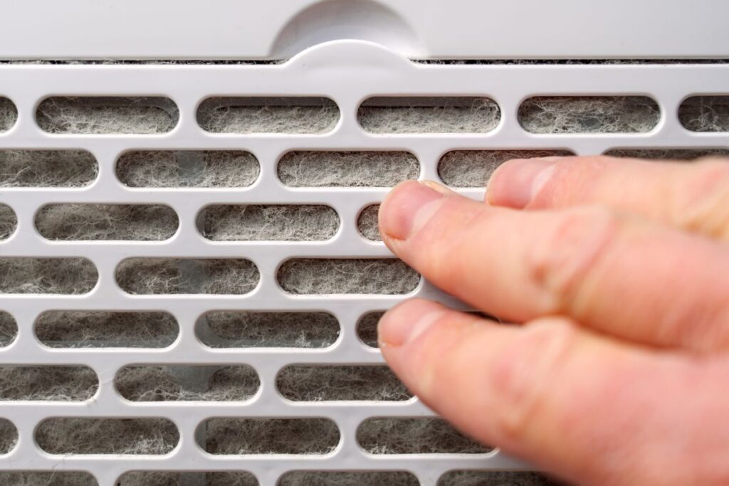 static pressure hvac hand touching vent filter