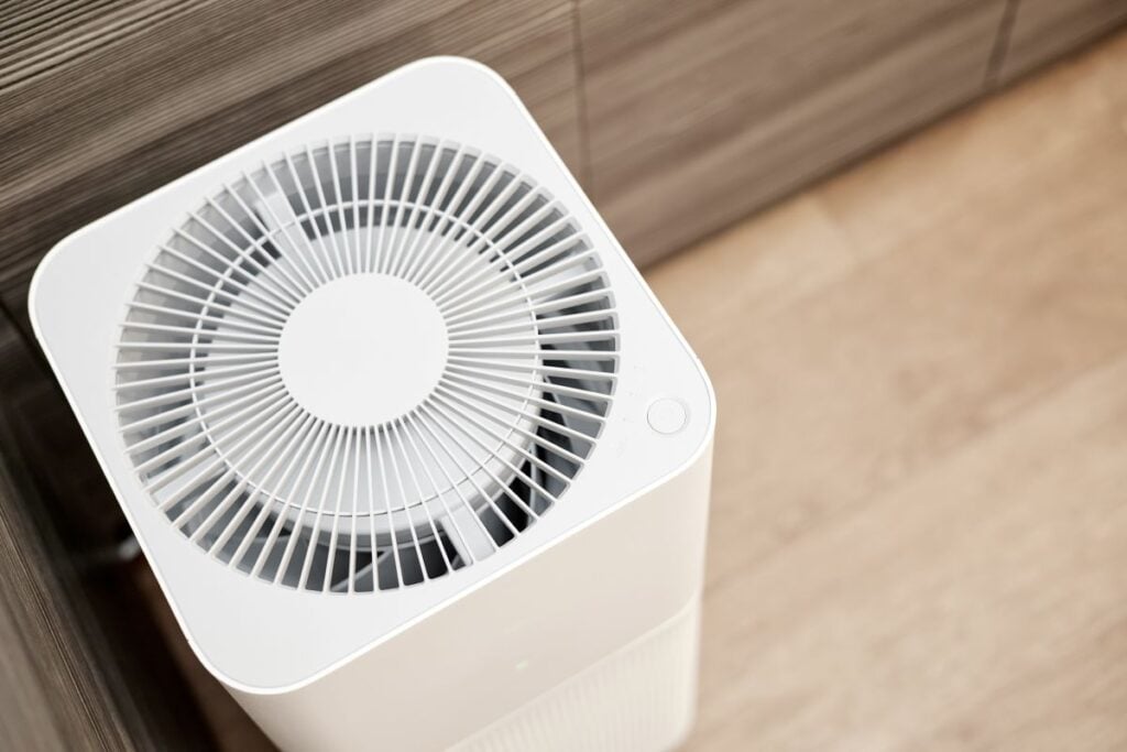 White air purifier in the kitchen of the apartment. Close-up, selective focus