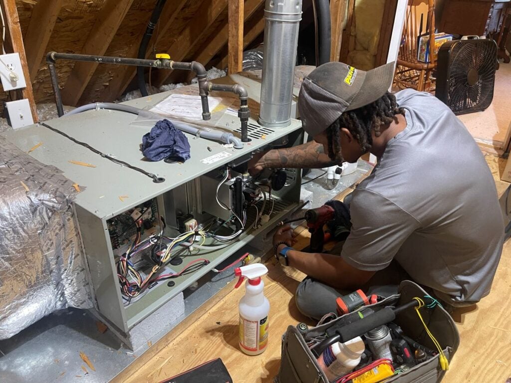Panther HVAC technician working on AC maintenance